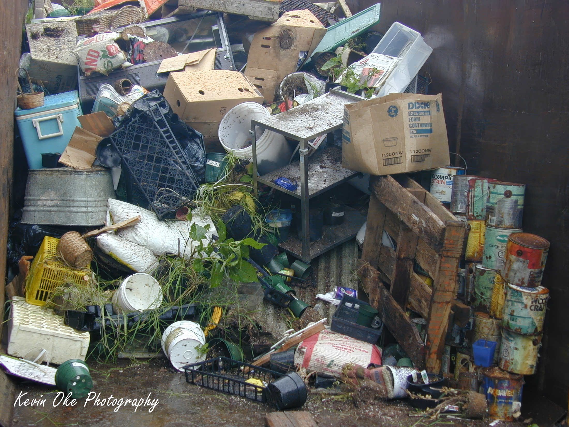 Garbage bin full of junk