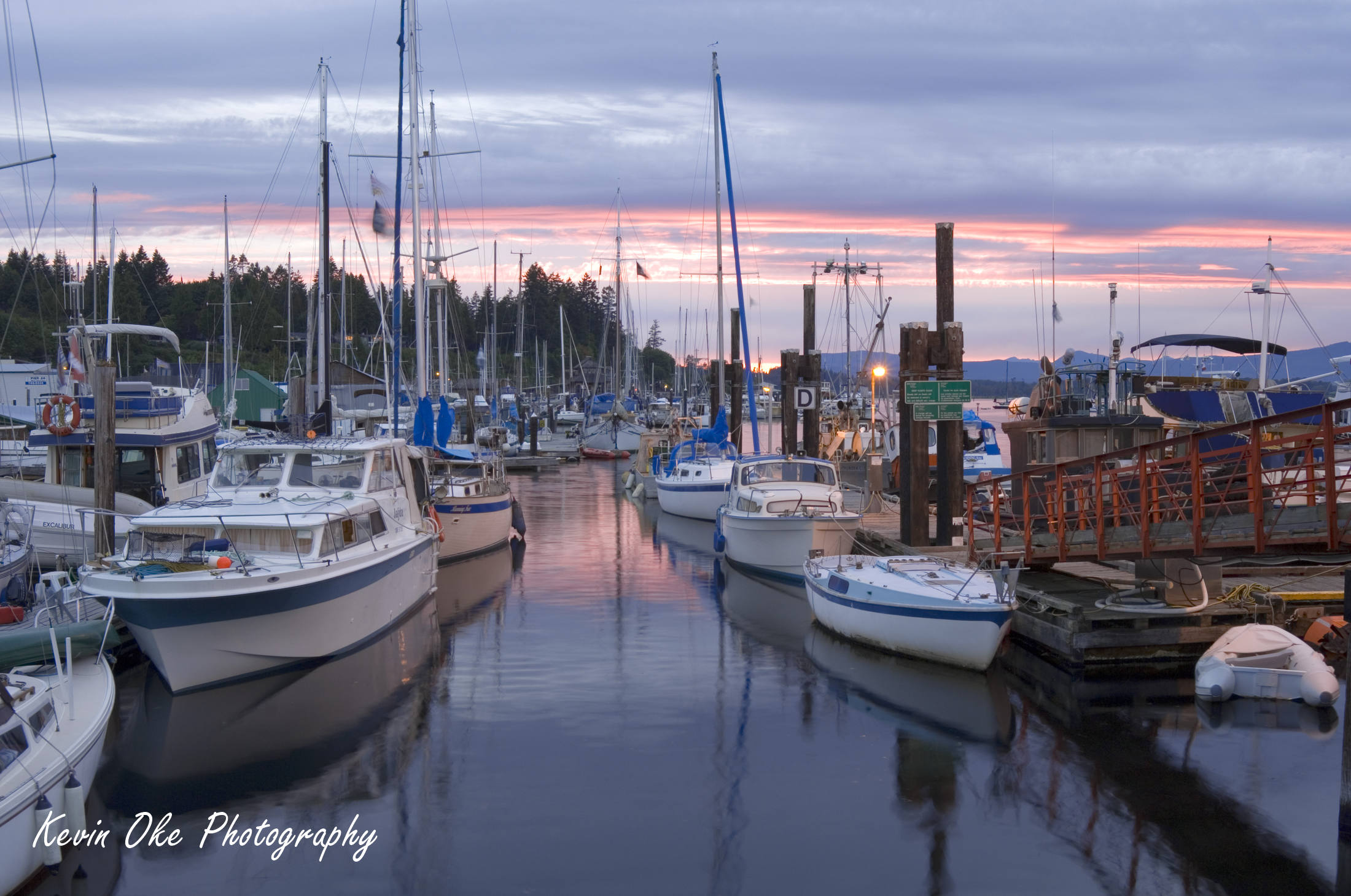 Fisherman's Wharf at sunset with a calm ocean, Cowichan Bay, British Columbia, Canada