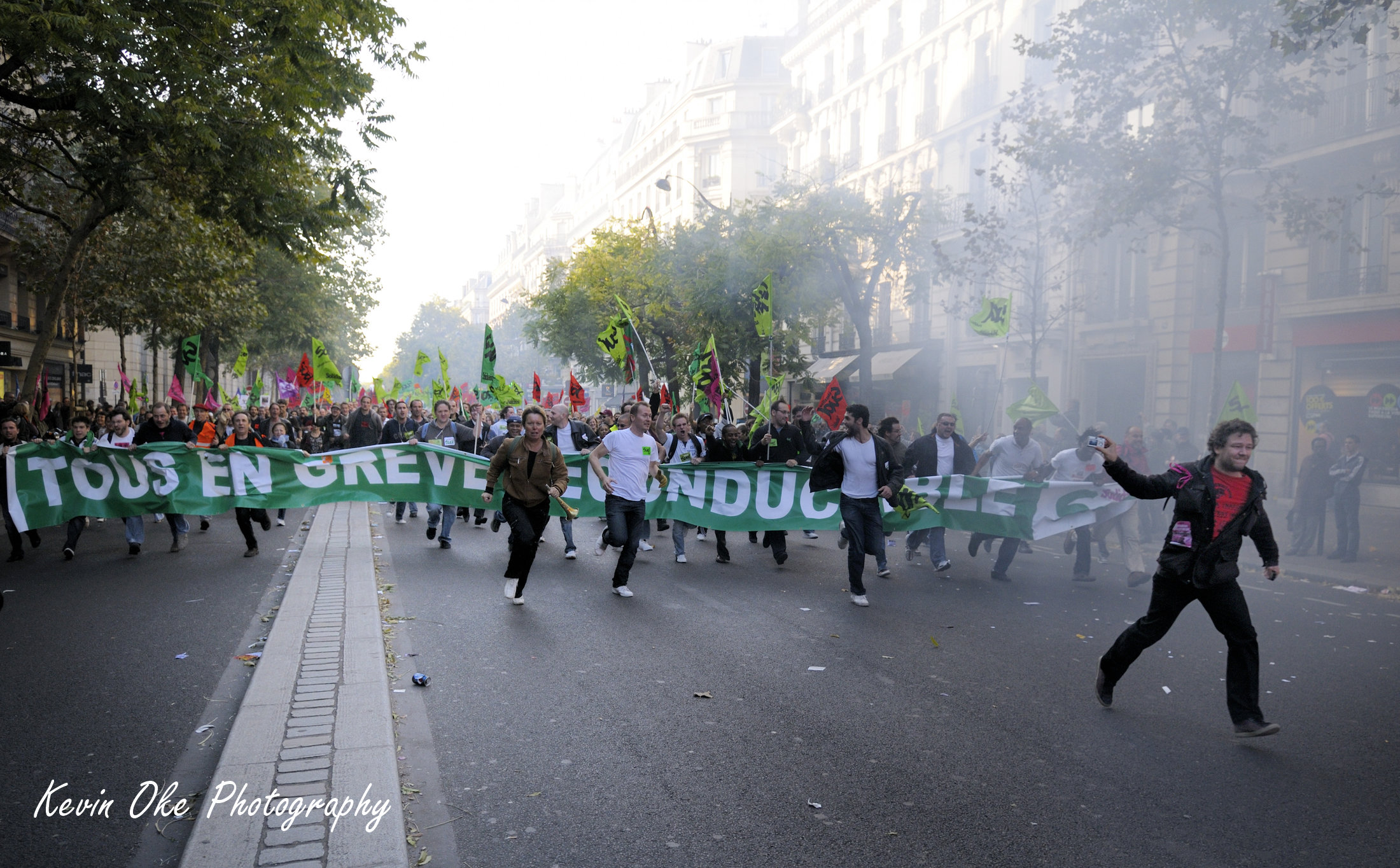 Running through smoke, France Pension Protest, 12 October 2010, Paris, Île-de-France, France