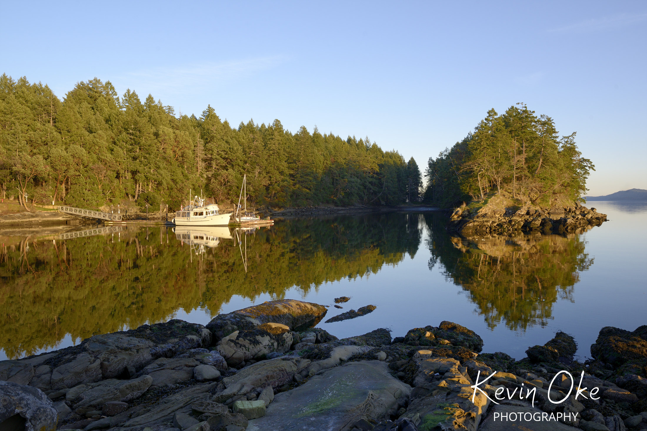 Pleasure boats at the wharf in Conover Cove, Wallace Island, Gulf Islands, British Columbia, Canada