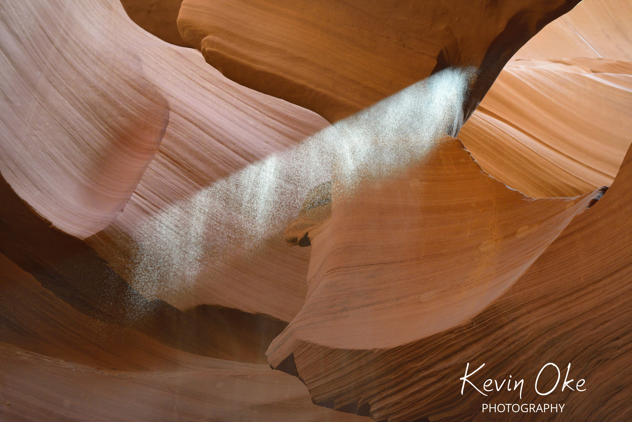 Thrown sand illuminated by a shaft of light, Lower Antelope Canyon, Hasdestwazi, LeChee Chapter, Navajo Nation, Arizona